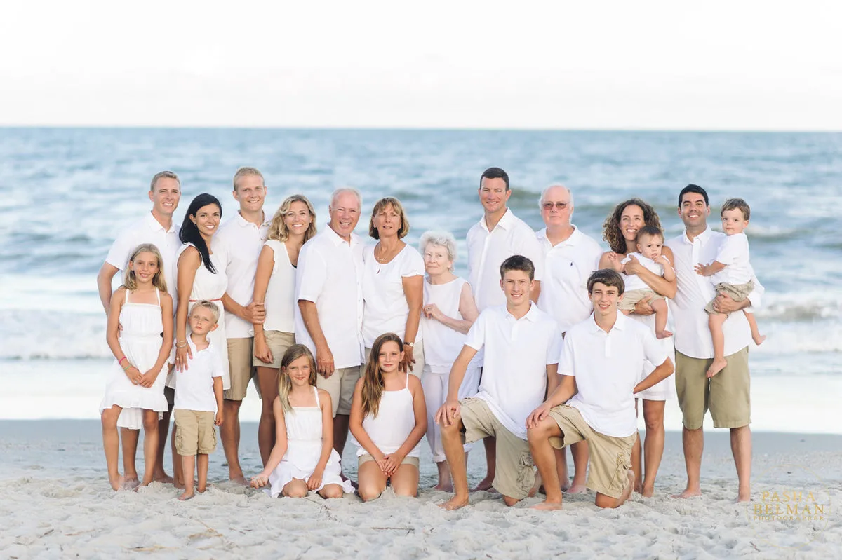 Big family in white posing on the beach in Garden City Beach SC