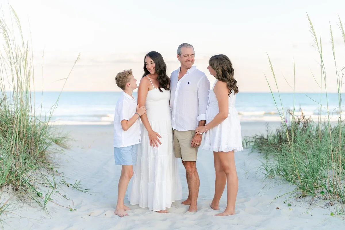 Family of four in the sea oats in Garden City Beach SC
