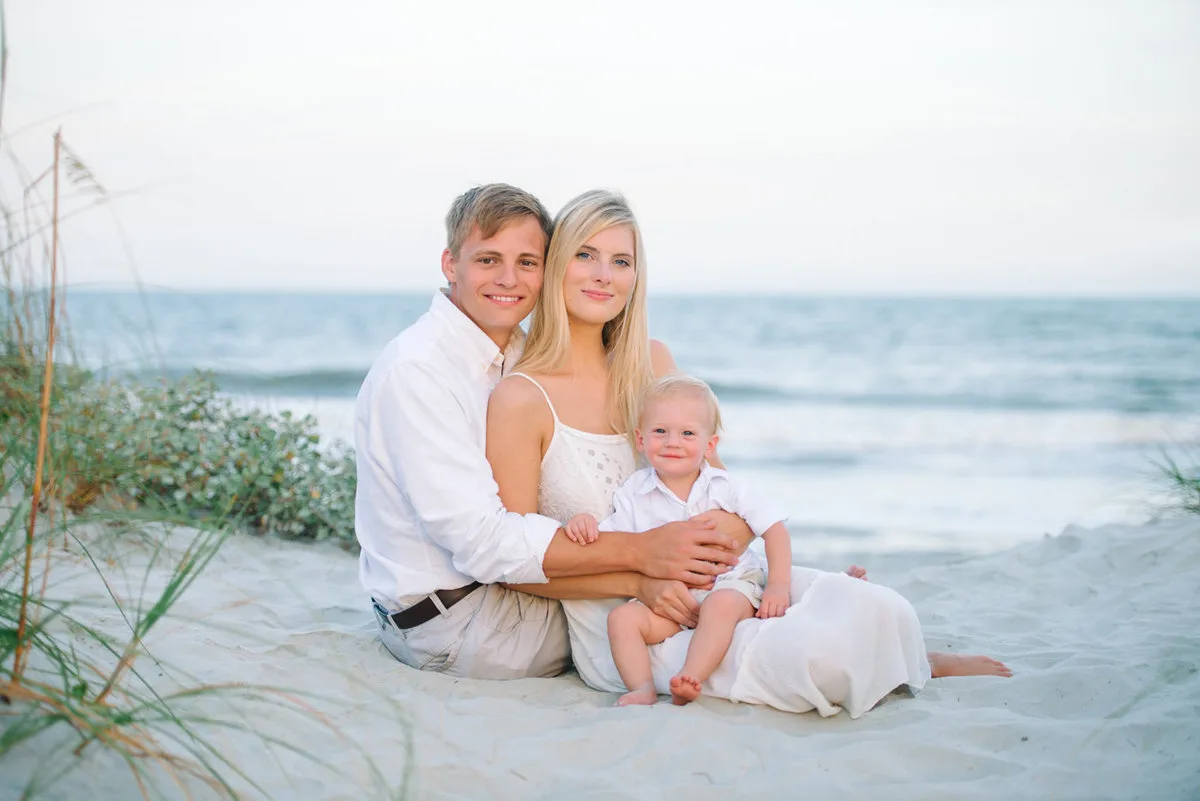 Grandparents and baby in the dunes in Garden City Beach SC