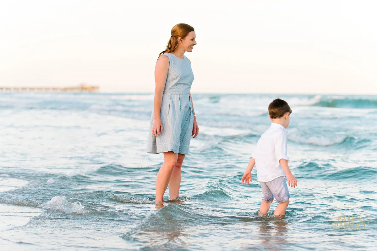 Mother and son playing in the waves in Garden City Beach SC