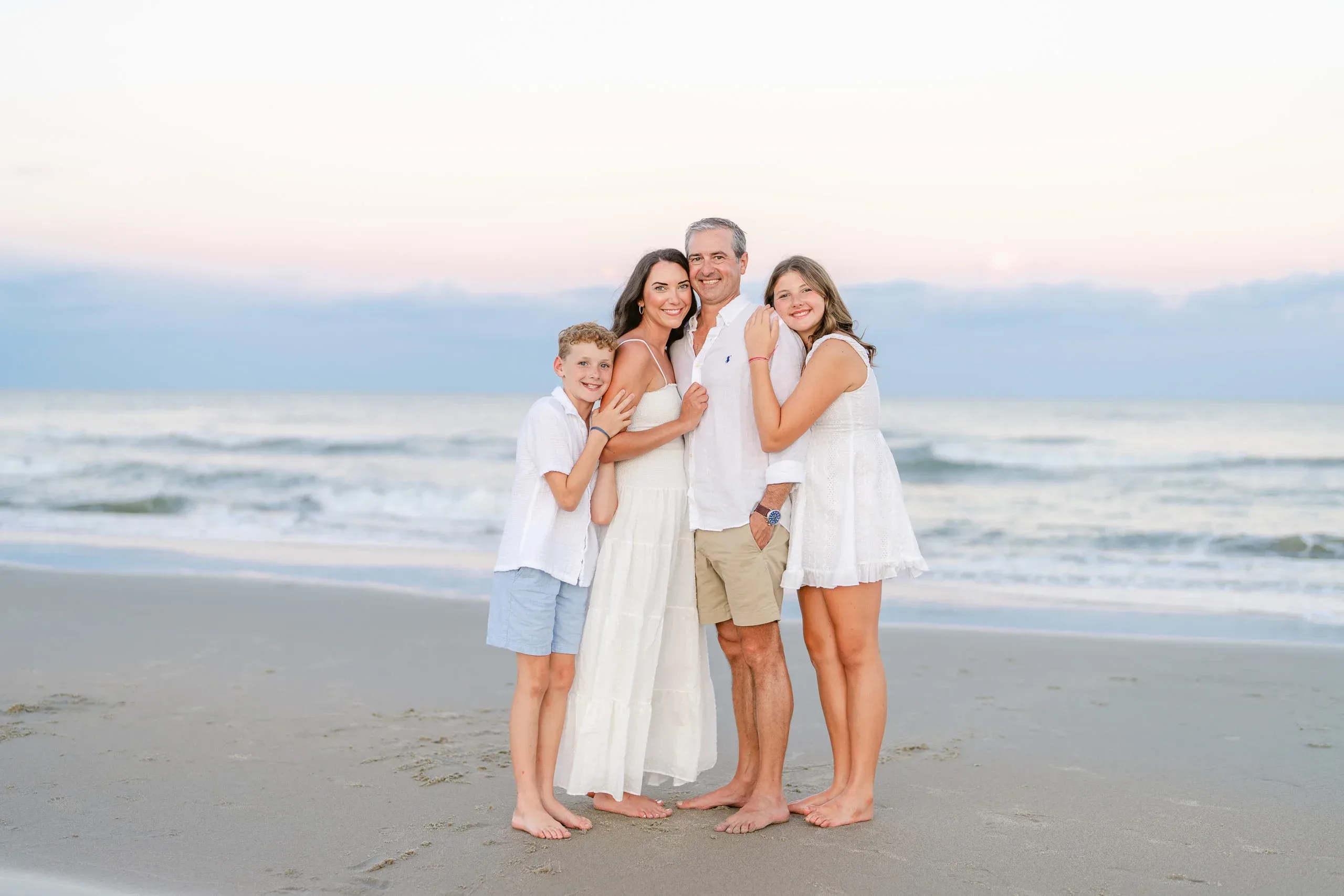 Family portrait by the water by Pasha Belman Photography