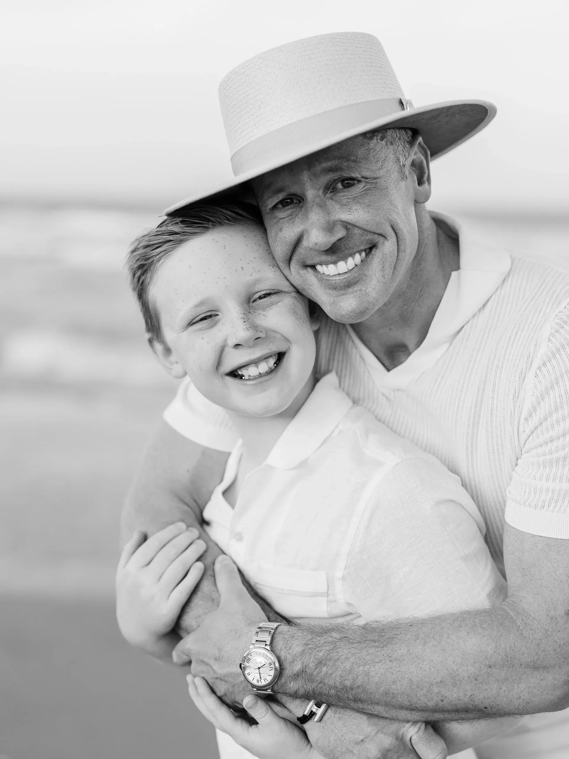 Black and white portrait of a father and son by Pasha Belman Photography