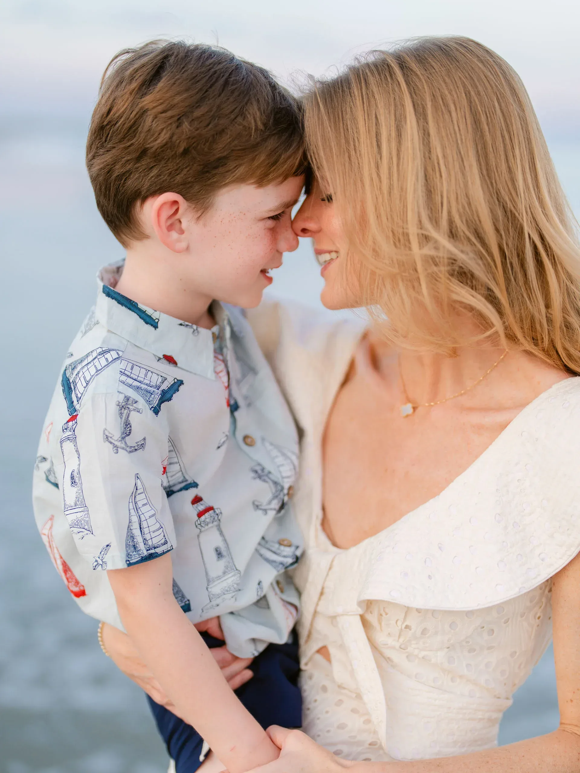 Mother and son touching foreheads by Pasha Belman Photography