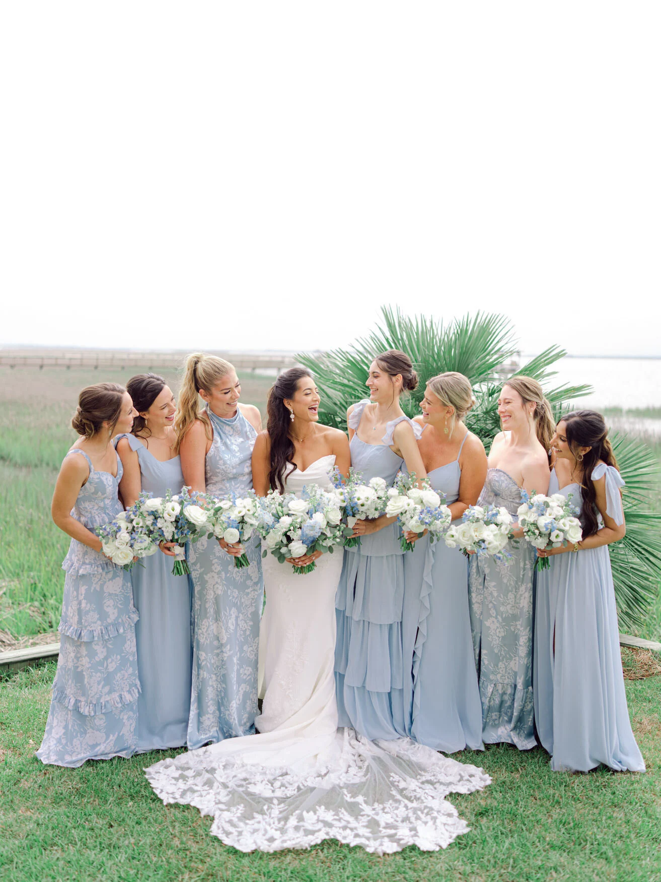 Bride with her bridesmaids in dusty blue dresses