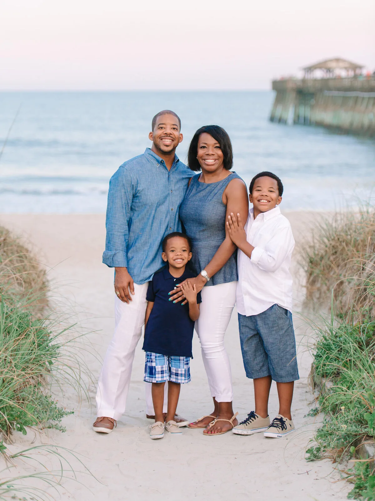 Family of four on the dune path near the pier in North Myrtle Beach