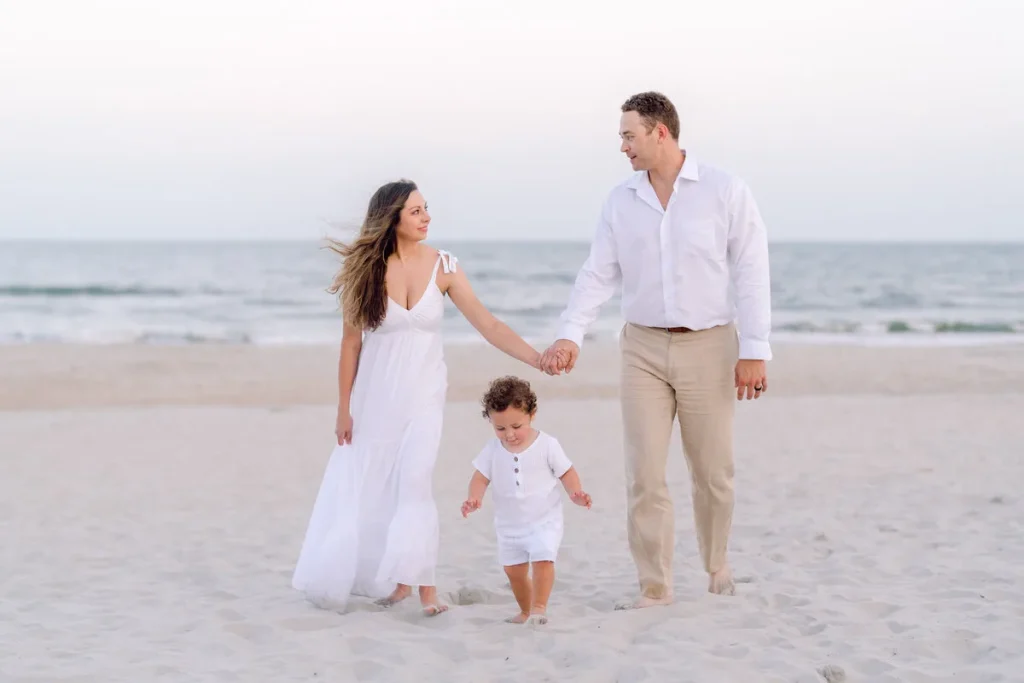 Parents and toddler walking the beach in North Myrtle Beach