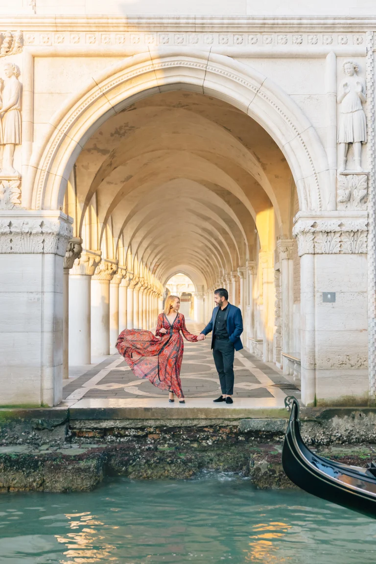 Pasha and Natallia Belman under the arches in Venice, Italy