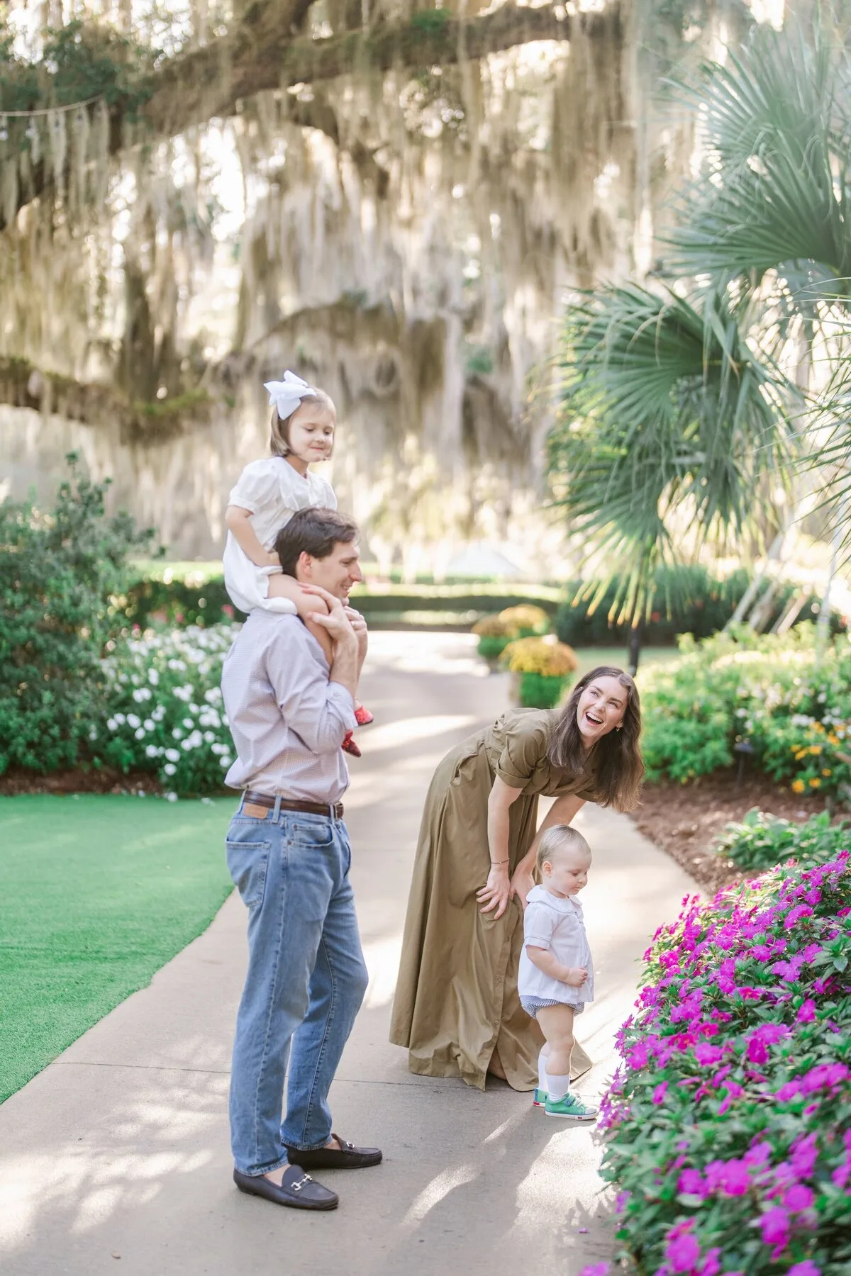 Family under Spanish moss at DeBordieu Colony in Georgetown SC
